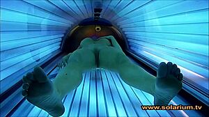 beautiful woman teases solarium cam with secret masturbation show