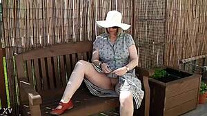 Naughty girl strips naked in outdoor garden!