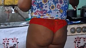 check out this curvy ebony bbw flashing her huge tits and cameltoe in the kitchen