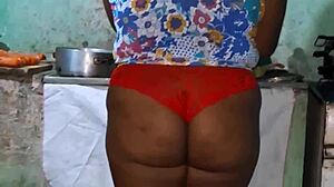 check out this curvy ebony bbw flashing her huge tits and cameltoe in the kitchen