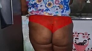 check out this curvy ebony bbw flashing her huge tits and cameltoe in the kitchen