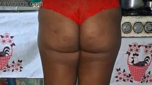 check out this curvy ebony bbw flashing her huge tits and cameltoe in the kitchen