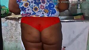 check out this curvy ebony bbw flashing her huge tits and cameltoe in the kitchen