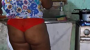 check out this curvy ebony bbw flashing her huge tits and cameltoe in the kitchen