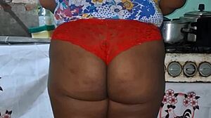 check out this curvy ebony bbw flashing her huge tits and cameltoe in the kitchen