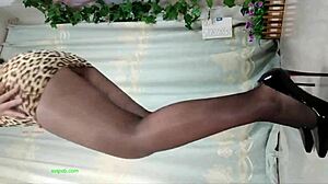 watch her dance seductively in sheer pantyhose and sky-high heels showing off those long legs