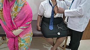 Doctor examines patient right in front of watchful mom at hospital
