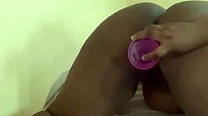 hot ebony babe spreads her huge wet black pussy wide for deep dildo pounding