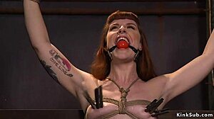 Redhead slave gagged tied up chokes on deepthroat banging while bound in rough group submission