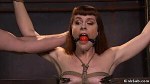 Redhead slave gagged tied up chokes on deepthroat banging while bound in rough group submission