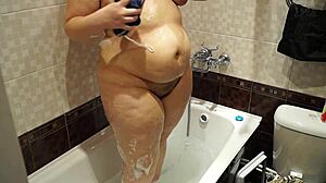 curvy milf with big ass washes body in bath at home