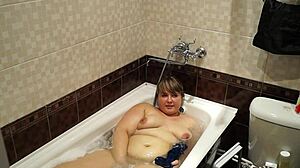 curvy milf with big ass washes body in bath at home