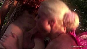 Outdoor threesome between two guys in costumes and a horny cock sucking blonde milf