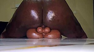 ebony girl fingers her creamy tight pussy during homemade masturbation