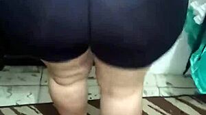 Watch this mature lady shake her big ass in shiny spandex.