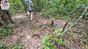 Thai teen walks in forest and shows pussy