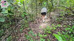 Thai teen walks in forest and shows pussy