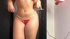 Blonde woman in micro bikini paired with stylish high heels shoes