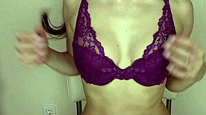 Sultry brunette tries on new lingerie seductively