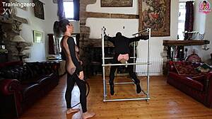 Intense whipping on wooden bondage frame