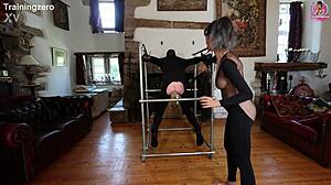 Intense whipping on wooden bondage frame