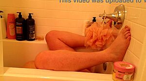 curvy pregnant woman relaxes in bathroom with natural curves