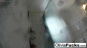 pierced olivia, this blonde milf, washes off her nude body after a long day