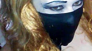 Face mask hides mouth during black dildo play