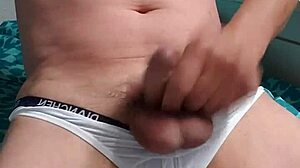 Gay boy masturbates under underwear intriguingly