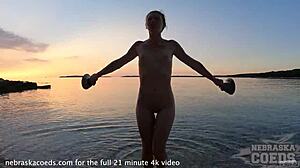 Adorable European Girl Performs Nude Fire Dancing on Beach at Sunset