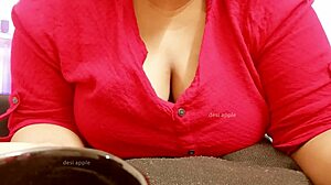 The Asian milf says, 'Watch me play with my big boobs.'