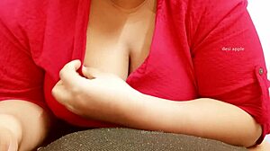 The Asian milf says, 'Watch me play with my big boobs.'