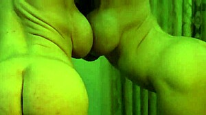 Busty ginger bodybuilder flexes huge muscles and tits in mirror