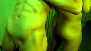 Busty ginger bodybuilder flexes huge muscles and tits in mirror