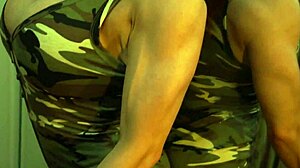 Busty ginger bodybuilder flexes huge muscles and tits in mirror