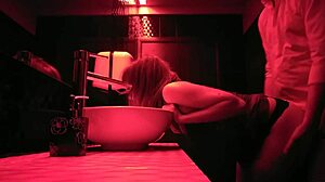 A couple engages in passionate sex in the bathroom