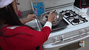 baking christmas cookies in a short skirt reveals cameltoe and upskirt views. tempting socks add holiday spice