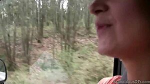 hot babe stroking cock in car while guy drives, caught on wild tape.