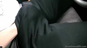 hot babe stroking cock in car while guy drives, caught on wild tape.