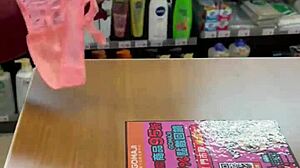 Asian ladyboy flaunts sexy thong in public store setting.