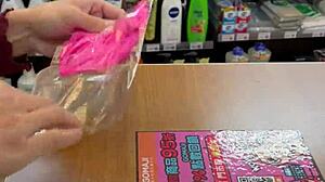 Asian ladyboy flaunts sexy thong in public store setting.