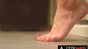 gorgeous sybil gives footjob in stockings to monster cock