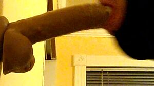 Gay Guy Deepthroats Dildo In Hood.