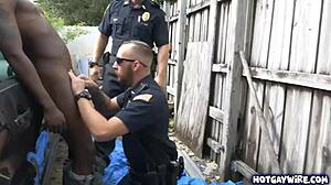 Two rough police officers dominate black guy in office 3some