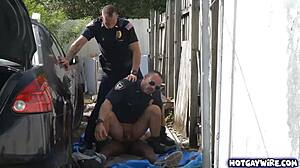 Two rough police officers dominate black guy in office 3some