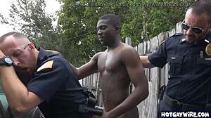 Two rough police officers dominate black guy in office 3some