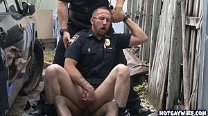 Two rough police officers dominate black guy in office 3some