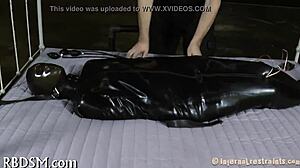 Exploring intense bondage and sadomasochism with tight restraints and control.