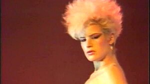 Blonde porn star legend Lois Ayres strips and shakes her ass before getting fucked hard on stage.