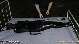 Exploring intense bondage and sadomasochism with tight restraints and control.